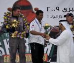 Qatar team manager on podium